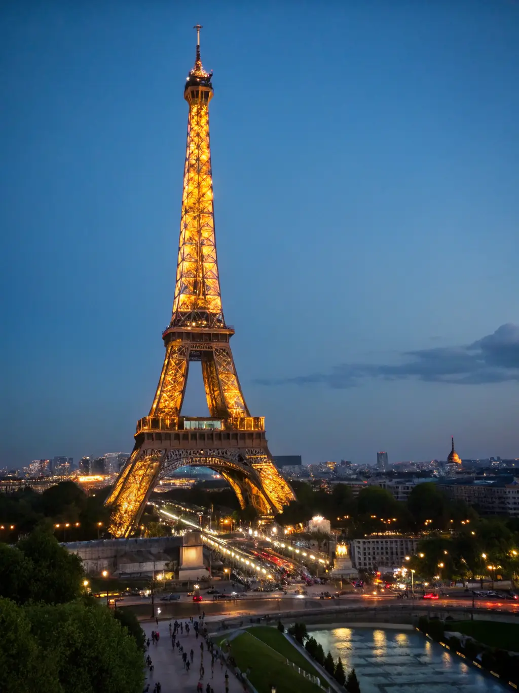 A stunning image of the Eiffel Tower in Paris at night, illuminated against the dark sky, symbolizing romance and the allure of European travel.